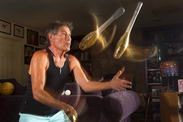 Nino Frediani, 73, juggles clubs at his home Tuesday, Sept. 3, 2013. The club heads are covered in gold tape so that he can see them better. Frediani has performed as a professional juggler in Las Vegas for more than 30 years but few people knew that he is legally blind.