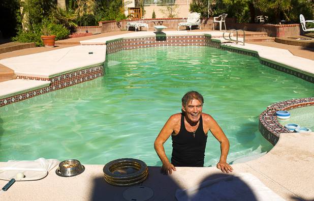 Nino Frediani, 73, is shown in his backyard pool Tuesday, Sept. 3, 2013. Frediani has performed as a professional juggler in Las Vegas for more than 30 years but few people knew that he is legally blind.