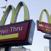 In this Dec. 20, 2010, file photo, McDonald's signs sprout from the restaurant's parking lot in New York.
