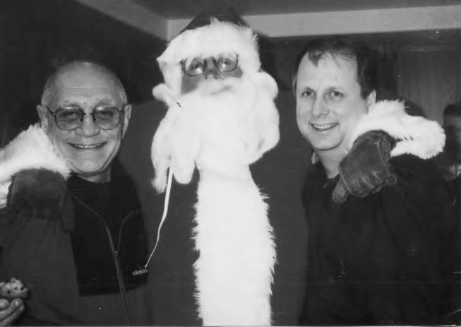 In this undated photo Former UNLV basketball coach Jerry Tarkanian (left) poses with assistant coaches Mark Warkentien (right) and Tim Grgurich (Santa).  