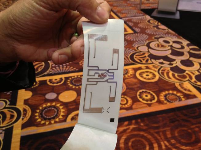 Bag tags issued at McCarran International Airport have radio frequency identification devices embedded in the tag to easily locate and identify a bag, shown at the Future Travel Experience Global trade show on Sept. 5, 2013.