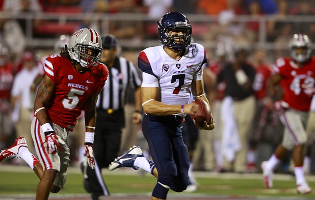 University of Arizona quarterback B.J. Denker keeps the ball and runs for a touchdown during UNLV's home opener against the University of Arizona at Sam Boyd Stadium Saturday, Sept. 7, 2013.