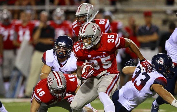 UNLV'S Tim Cornett looks for running room during UNLV's home opener against the University of Arizona at Sam Boyd Stadium Saturday, Sept. 7, 2013.