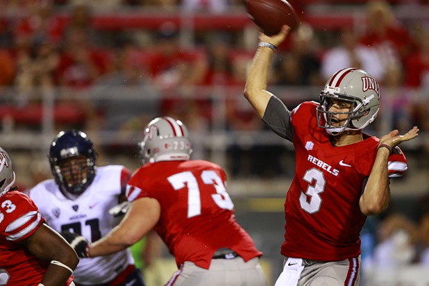 UNLV quarterback Nick Sherry passes during UNLV's home opener against the University of Arizona at Sam Boyd Stadium Saturday, Sept. 7, 2013.