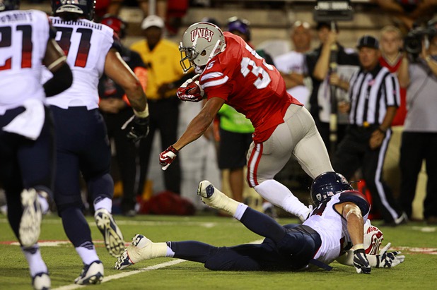 UNLV'S Tim Cornett breaks a tackle during UNLV's home opener against the University of Arizona at Sam Boyd Stadium Saturday, Sept. 7, 2013.