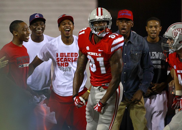 UNLV basketball players celebrate after UNLV'S Devante Davis scored on a touchdown run during UNLV's home opener against the University of Arizona at Sam Boyd Stadium Saturday, Sept. 7, 2013.