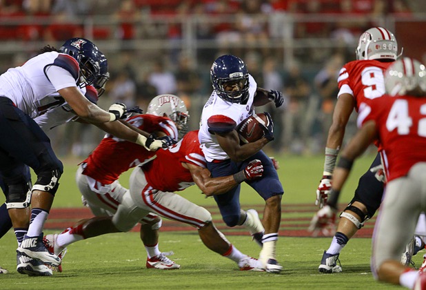 University of Arizona Daniel Jenkins (3) carries the ball during UNLV's home opener against UA at Sam Boyd Stadium Saturday, Sept. 7, 2013.