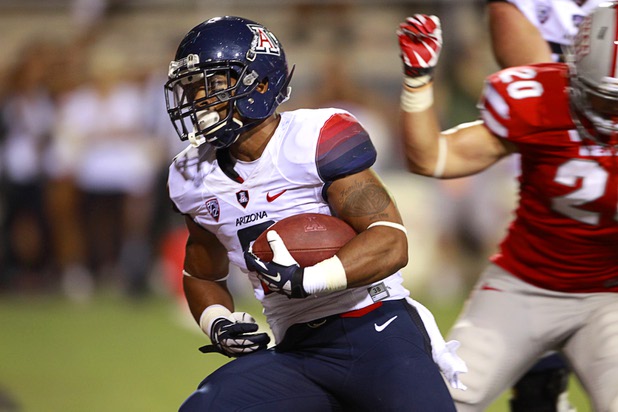 University of Arizona running back Kylan Butler (2) breaks away for UA final touchdown during UNLV's home opener against UA at Sam Boyd Stadium Saturday, Sept. 7, 2013.
