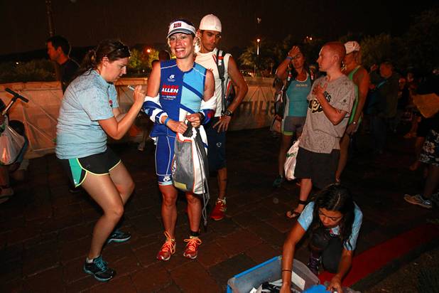 Palmira Alvarez, 31, of Mexico City is body marked as she arrives at Lake Las Vegas for the Ironman 70.3 World Championship in Henderson Sunday, Sept. 8, 2013. More than 1,800 athletes from around the U.S. and 53 countries qualified for the event.