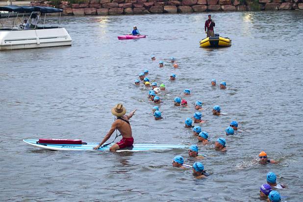 Athletes in the Po-Men division line up for the start of the Ironman 70.3 World Championship at Lake Las Vegas in Henderson Sunday, Sept. 8, 2013. More than 1,800 athletes from around the U.S. and 53 countries qualified for the event.