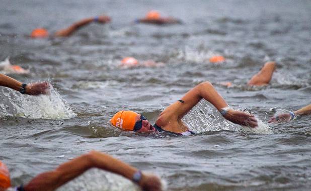 Women in the 50 years and older division start their 1.2-mile swim during the Ironman 70.3 World Championship in Henderson Sunday, Sept. 8, 2013. More than 1,800 athletes from around the U.S. and 53 countries qualified for the event.