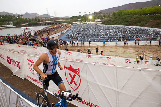 Professional triathlete Lennox Head of Australia heads to the road course after completing his swim during the Ironman 70.3 World Championship at Lake Las Vegas in Henderson Sunday, Sept. 8, 2013. More than 1,800 athletes from around the U.S. and 53 countries qualified for the event.