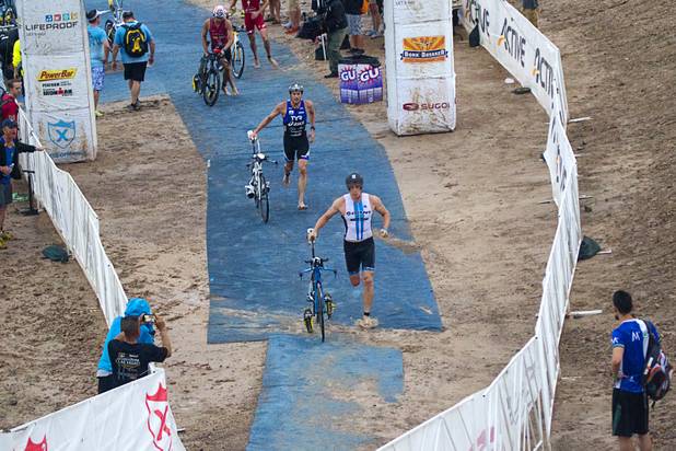 Triathletes head to the road course after completing their swim during the Ironman 70.3 World Championship at Lake Las Vegas in Henderson Sunday, Sept. 8, 2013. More than 1,800 athletes from around the U.S. and 53 countries qualified for the event.