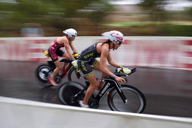 Female triathletes start on a 56-mile ride during the Ironman 70.3 World Championship at Lake Las Vegas in Henderson Sunday, Sept. 8, 2013. More than 1,800 athletes from around the U.S. and 53 countries qualified for the event.