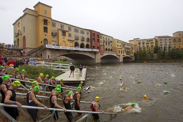 Men in the 40 to 44-year-old division enter the water as they prepare to start their 1.2 mile swim during the Ironman 70.3 World Championship at Lake Las Vegas in Henderson Sunday, Sept. 8, 2013. More than 1,800 athletes from around the U.S. and 53 countries qualified for the event.
