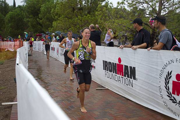 Athletes head to their bicycles after finishing a 1.2-mile swim during the Ironman 70.3 World Championship at Lake Las Vegas in Henderson Sunday, Sept. 8, 2013. More than 1,800 athletes from around the U.S. and 53 countries qualified for the event.
