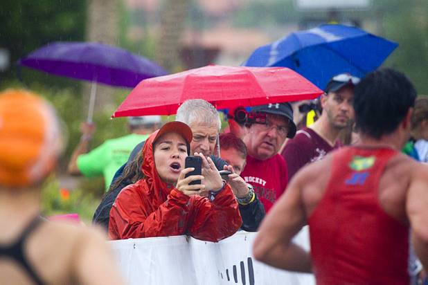 Spectators take photos and video of family members and friends during the Ironman 70.3 World Championship at Lake Las Vegas in Henderson Sunday, Sept. 8, 2013. More than 1,800 athletes from around the U.S. and 53 countries qualified for the event.