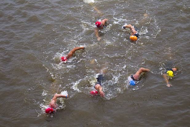 Athletes finish a 1.2-mile swim during the Ironman 70.3 World Championship at Lake Las Vegas in Henderson Sunday, Sept. 8, 2013. More than 1,800 athletes from around the U.S. and 53 countries qualified for the event.