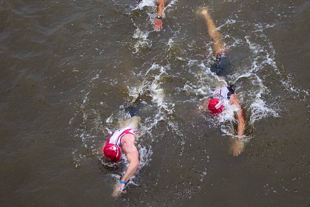 Athletes finish a 1.2-mile swim during the Ironman 70.3 World Championship at Lake Las Vegas in Henderson Sunday, Sept. 8, 2013. More than 1,800 athletes from around the U.S. and 53 countries qualified for the event.