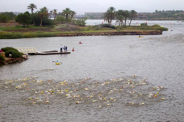 Athletes head out on a 1.2-mile swim during the Ironman 70.3 World Championship at Lake Las Vegas in Henderson Sunday, Sept. 8, 2013. More than 1,800 athletes from around the U.S. and 53 countries qualified for the event.