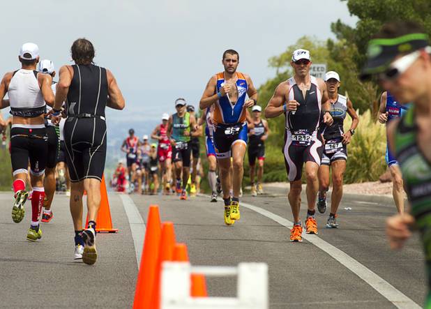 Athletes make a turn at Horizon Ridge Parkway after running up Green Valley Parkway during the Ironman 70.3 World Championship in Henderson Sunday, Sept. 8, 2013. The 13.1 mile run comes after a 56-mile bicycle course and a 1.2-mile swim in Las Las Vegas. More than 1,800 athletes from around the U.S. and 53 countries qualified for the event.