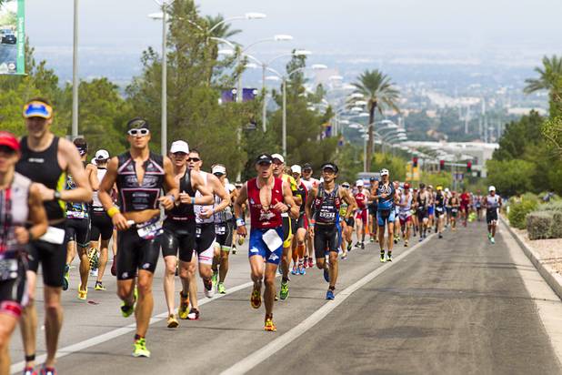 Athletes run uphill Green Valley Parkway toward Horizon Ridge Parkway during the Ironman 70.3 World Championship in Henderson Sunday, Sept. 8, 2013. The 13.1 mile run comes after a 56-mile bicycle course and a 1.2-mile swim in Las Las Vegas. More than 1,800 athletes from around the U.S. and 53 countries qualified for the event.