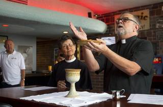 Deacon Bonnie Polley, left, and Episcopal priest Buck Belmore  conduct an inaugural pub church service at the Atomic, 917 East Fremont Street, in downtown Las Vegas Sunday, Sept. 8, 2013.
