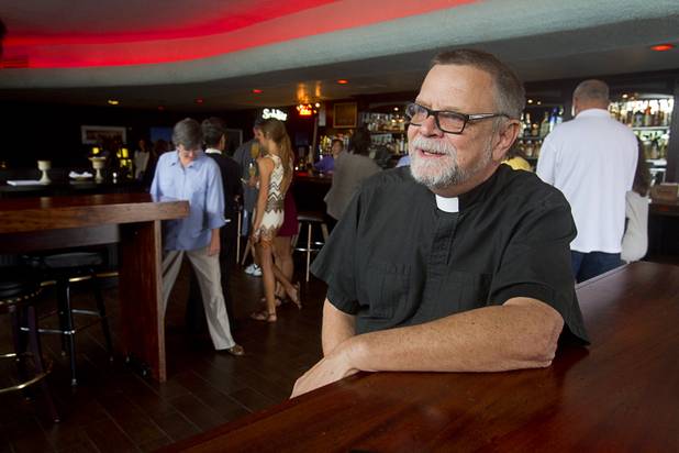 Buck Belmore, an Episcopal priest, talks about the pub church service following an inaugural service at the Atomic, 917 East Fremont Street, in downtown Las Vegas Sunday, Sept. 8, 2013.