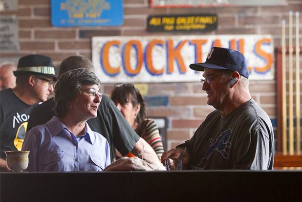 Connie Dee Belmore, left, an Episcopal priest, talks with Marl Petrimoulx following an inaugural pub church service at the Atomic, 917 East Fremont Street, in downtown Las Vegas Sunday, Sept. 8, 2013.