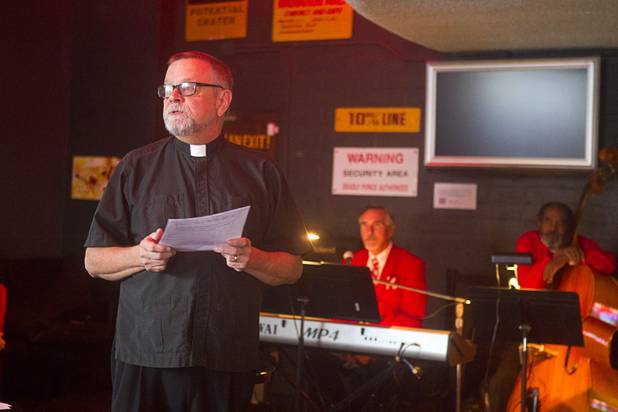 Buck Belmore, an Episcopal priest, gives a short sermon during an inaugural pub church service at the Atomic, 917 E. Fremont Street, in downtown Las Vegas on Sunday, Sept. 8, 2013.