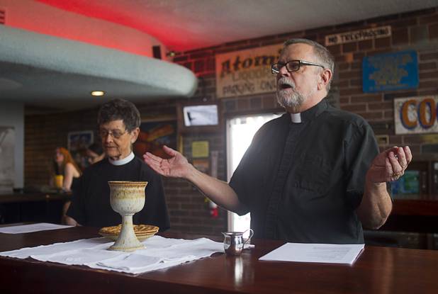 Deacon Bonnie Polley, left, and Episcopal priest Buck Belmore  conduct an inaugural pub church service at the Atomic, 917 East Fremont Street, in downtown Las Vegas Sunday, Sept. 8, 2013.