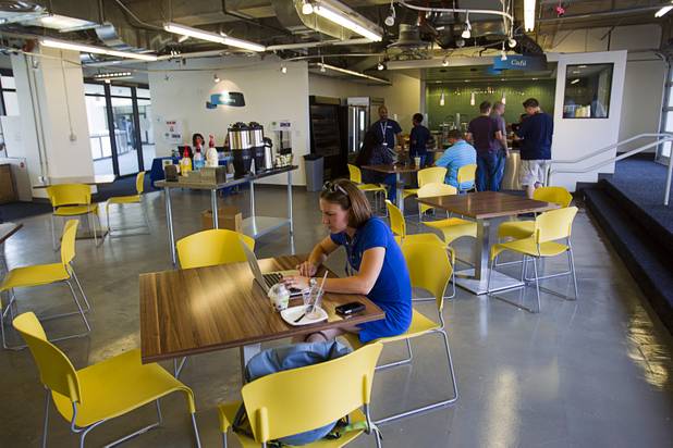Virginia Ruff, a Zappos Lab project manager, works in the Z Cafe at the Zappos headquarters in the old city hall building downtown Monday, Sept. 9, 2013. The downtown headquarters officially opened Monday.