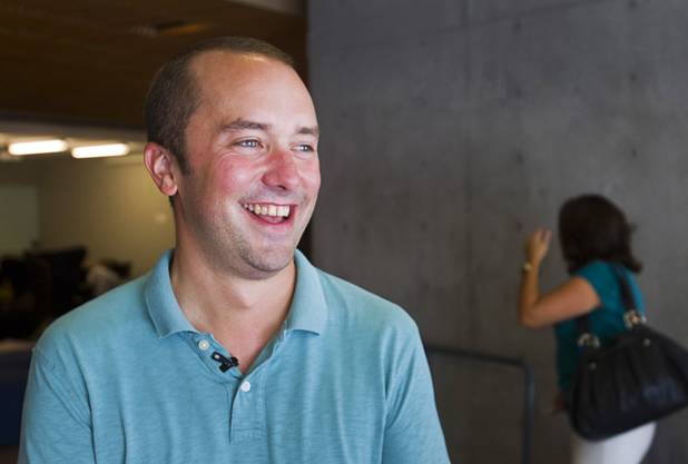 Zach Ware, Zappos head of campus development, smiles during a tour of the Zappos headquarters in the old city hall building downtown Monday, Sept. 9, 2013. The downtown headquarters officially opened Monday.