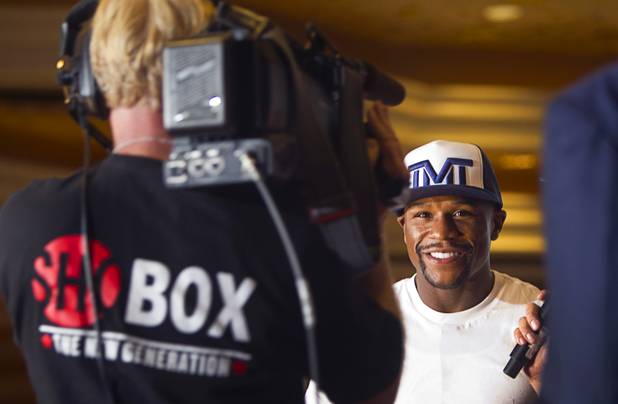 Undefeated boxer Floyd Mayweather Jr. arrives at the MGM Grand Tuesday, Sept. 10, 2013. Mayweather will face Canelo Alvarez of Mexico in a WBC/WBA 154-pound title fight at the MGM Grand Garden Arena on September 14. Alvarez is also undefeated with one draw. 