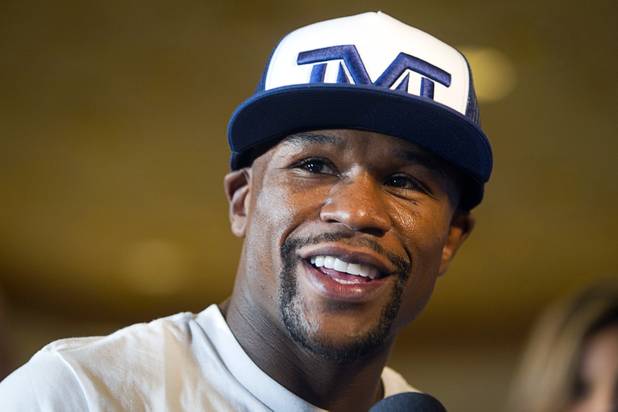 Undefeated boxer Floyd Mayweather Jr. makes his grand arrival at the MGM Grand Tuesday, Sept. 10, 2013. Mayweather will face Canelo Alvarez of Mexico in a WBC/WBA 154-pound title fight at the MGM Grand Garden Arena on Saturday.