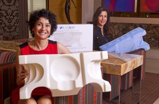 Dr. Goesel Anson and Cynthia Callendar, founders of the JuveRest pillow, pose with the sleep wrinkle pillow at the offices of Anson & Higgins Plastic Surgery Associates on Tuesday, Sept. 10, 2013. The pillow is designed to help minimize wrinkles caused by facial compression from pillow contact during sleep.