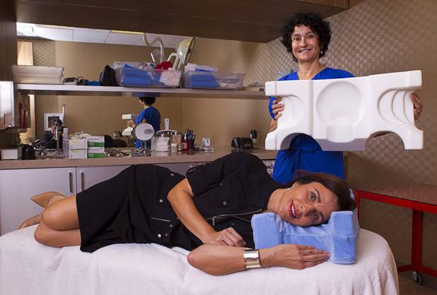 Dr. Goesel Anson and Cynthia Callendar, founders of the JuveRest pillow, pose with the sleep wrinkle pillow at the offices of Anson & Higgins Plastic Surgery Associates on Tuesday, Sept. 10, 2013. The pillow is designed to help minimize wrinkles caused by facial compression from pillow contact during sleep.