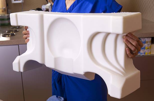 Dr. Goesel Anson, co-founder of the JuveRest pillow, holds a JuveRest sleep wrinkle pillow at the offices of Anson & Higgins Plastic Surgery Associates on Tuesday, Sept. 10, 2013. The pillow is designed to help minimize wrinkles caused by facial compression from pillow contact during sleep.