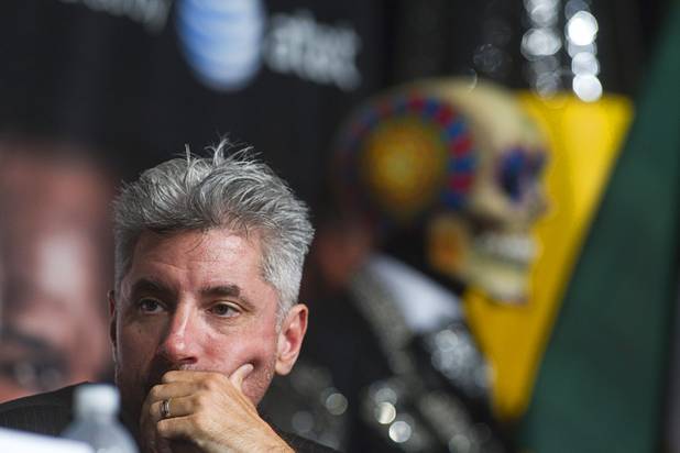 Keith Kizer, executive director of the Nevada State Athletic Commission, waits for boxers Floyd Mayweather Jr. and Canelo Alvarez of Mexico during a news conference at the MGM Grand Wednesday, Sept. 11, 2013. 