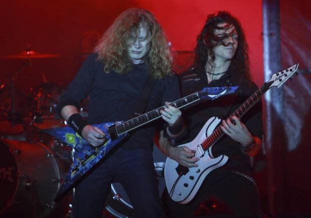 Dave Mustaine, left, and Cris Broderick, of the U.S. trash metal band Megadeth perform in concert in La Paz, Bolivia, Friday Nov. 25, 2011. 