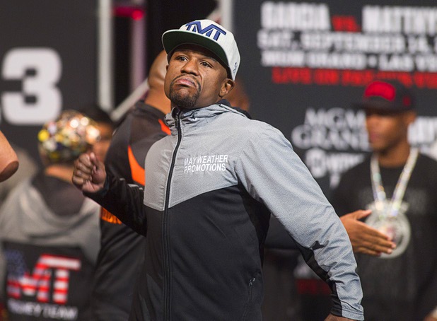 Floyd Mayweather Jr.arrives on stage during an official weigh-in at the MGM Grand Garden Arena on Friday, Sept. 13, 2013, for his fight against Canelo Alvarez of Mexico.