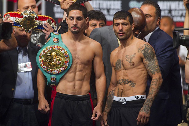 WBC/WBA junior welterweight champion Danny Garcia (L) and Lucas Matthysse of Argentina pose during an official weigh-in at the MGM Grand Garden Arena Friday Sept. 13, 2013. Garcia will defend his titles against Matthysse at the arena Saturday.