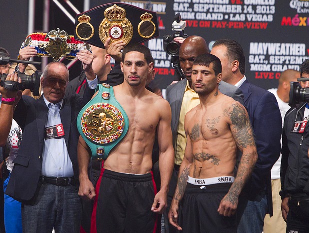 WBC/WBA junior welterweight champion Danny Garcia (L) and Lucas Matthysse of Argentina pose during an official weigh-in at the MGM Grand Garden Arena Friday Sept. 13, 2013. Garcia will defend his titles against Matthysse at the arena Saturday.