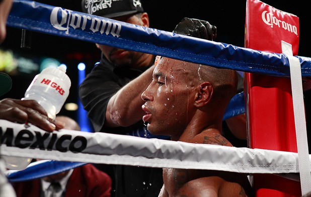 Ashley Theophane of England is treated between rounds in his corner during a welterweight fight against Pablo Cesar Cano of Mexico at the MGM Grand Garden Arena in Las Vegas, Nevada, September 14, 2013. Cano won the 10-round bout by spit decision.