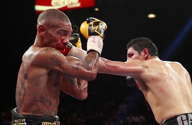 Pablo Cesar Cano, right, of Mexico lands a punch on Ashley Theophane of England during a welterweight fight at the MGM Grand Garden Arena in Las Vegas, Nevada, September 14, 2013. Cano won the 10-round bout by spit decision.