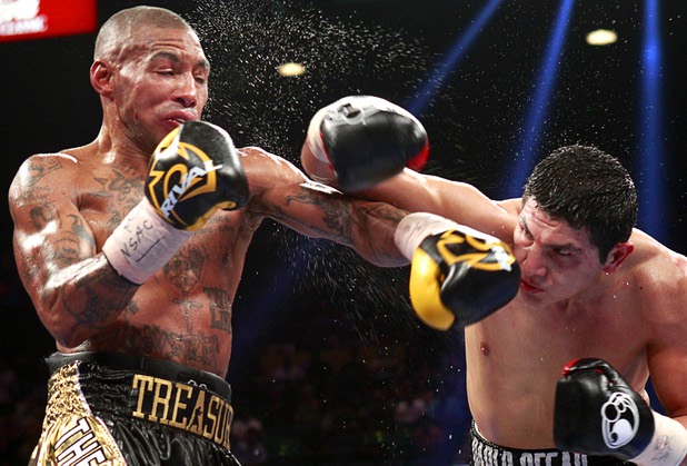 Pablo Cesar Cano, right, of Mexico lands a punch on Ashley Theophane of England during a welterweight fight at the MGM Grand Garden Arena in Las Vegas, Nevada, September 14, 2013. Cano won the 10-round bout by spit decision.