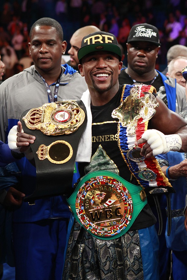 Floyd Mayweather Jr. celebrates his victory over WBC/WBA 154-pound champion Canelo Alvarez at the MGM Grand Garden Arena Saturday, Sept. 14, 2013. Alvarez was previously undefeated in 42 fights.