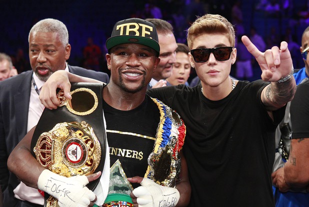 Floyd Mayweather Jr. and Justin Bieber celebrate Mayweather Jr.'s victory over WBC/WBA 154-pound champion Canelo Alvarez on Saturday, Sept. 14, 2013, at MGM Grand Garden Arena. Alvarez was previously undefeated in 42 fights.