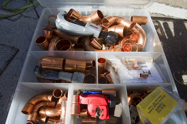 An assortment of copper pipe is shown as Stephen Molina and Tadone Phengrasamee, HVAC technicians for the Clark County School District, work at Cashman Middle School Tuesday, Sept. 17, 2013. As the effects of the recession continue to affect school operations and deferred maintenance costs continue to rise, the CCSD is finding it difficult to maintain school facilities.