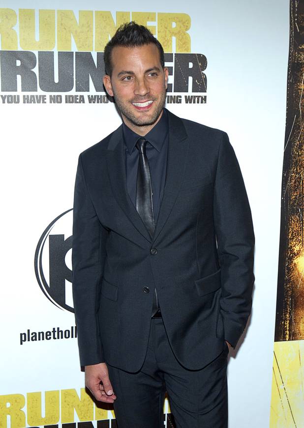 Director Brad Furman arrives for the world premiere of the Twentieth Century Fox and New Regency's film "Runner Runner" at Planet Hollywood Wednesday, September 18, 2013.